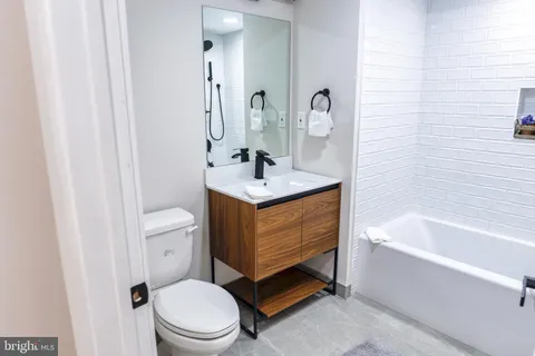 a bathroom with a shower and a tub