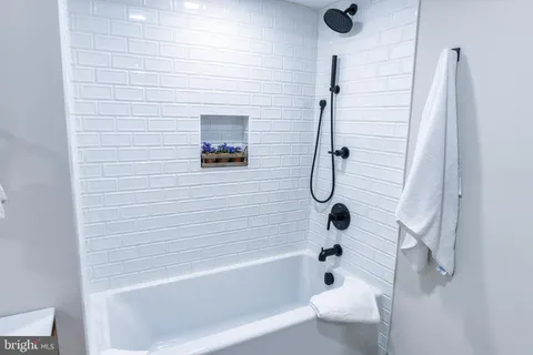 a bathroom with a sink double vanity and a mirror