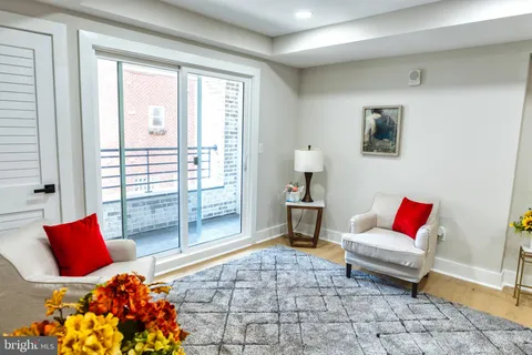 a living room with furniture and a rug