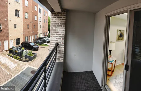 a view of a balcony and chairs