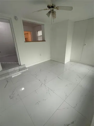 a view of a livingroom with a ceiling fan