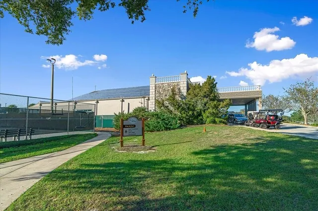 a view of a house with a backyard and a slide