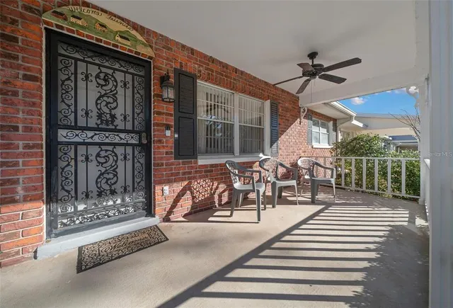 a view of a patio with table and chairs