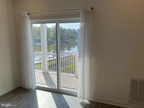 a view of a balcony with wooden floor