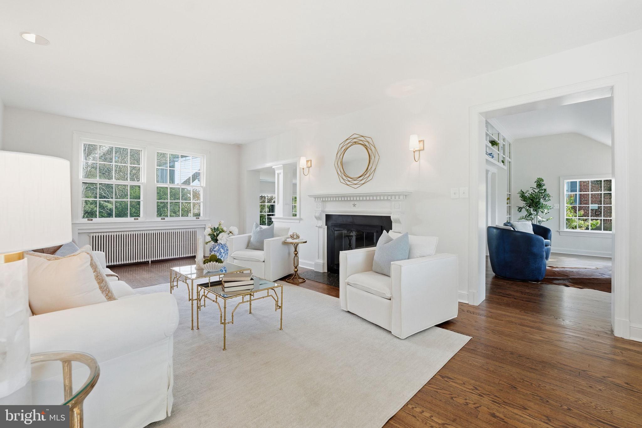 3225 North Glebe Road Arlington, VA 22207 - Photo 8 of 102 a living room with furniture a fireplace and a large window