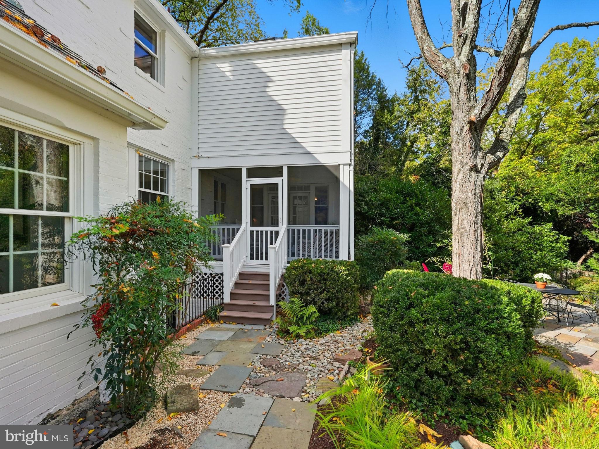 3225 North Glebe Road Arlington, VA 22207 - Photo 82 of 102 a view of a house with potted plants and a large tree