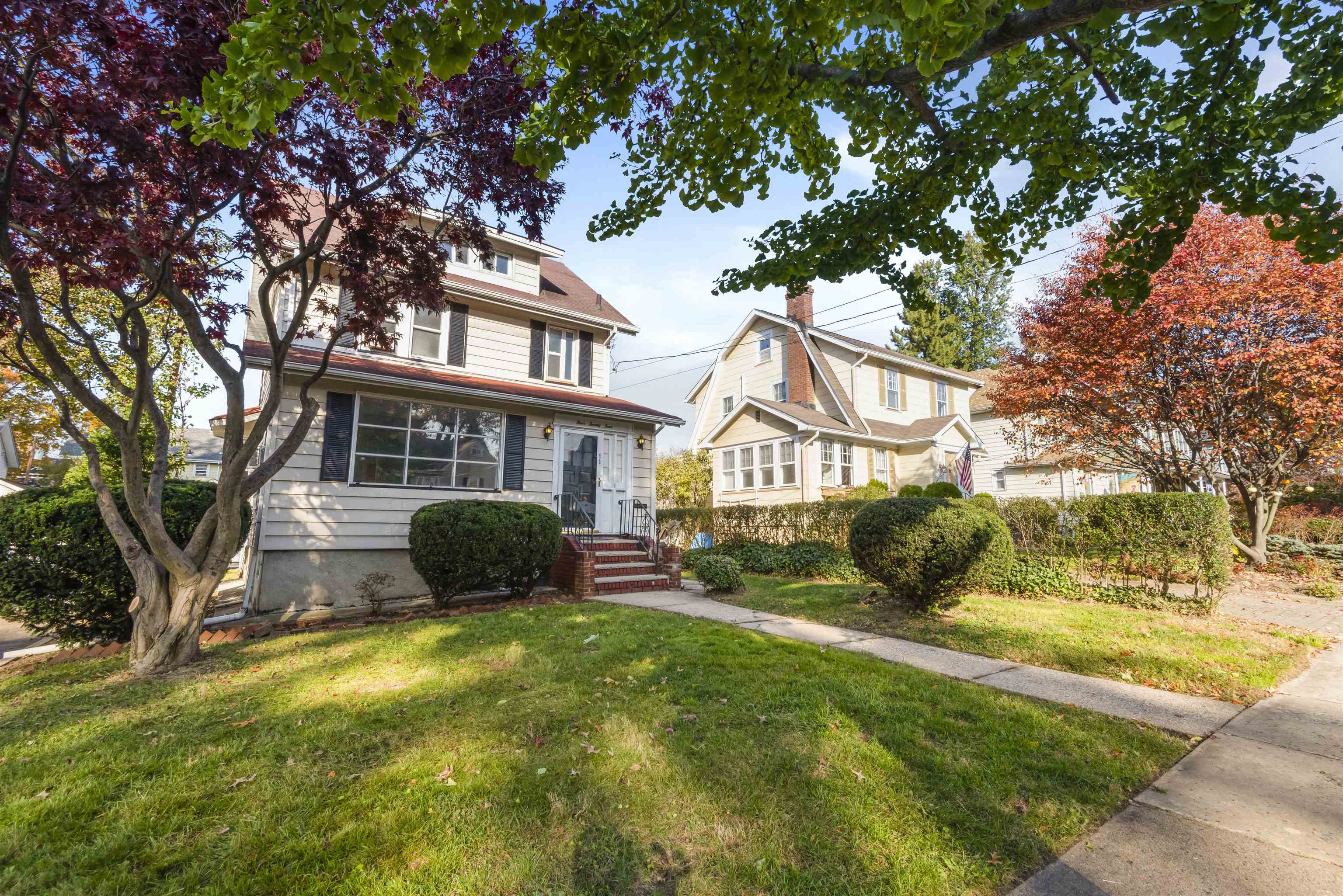 424 Lincoln Avenue Rutherford, NJ 07070 - Photo 2 of 30 a front view of a house with a yard