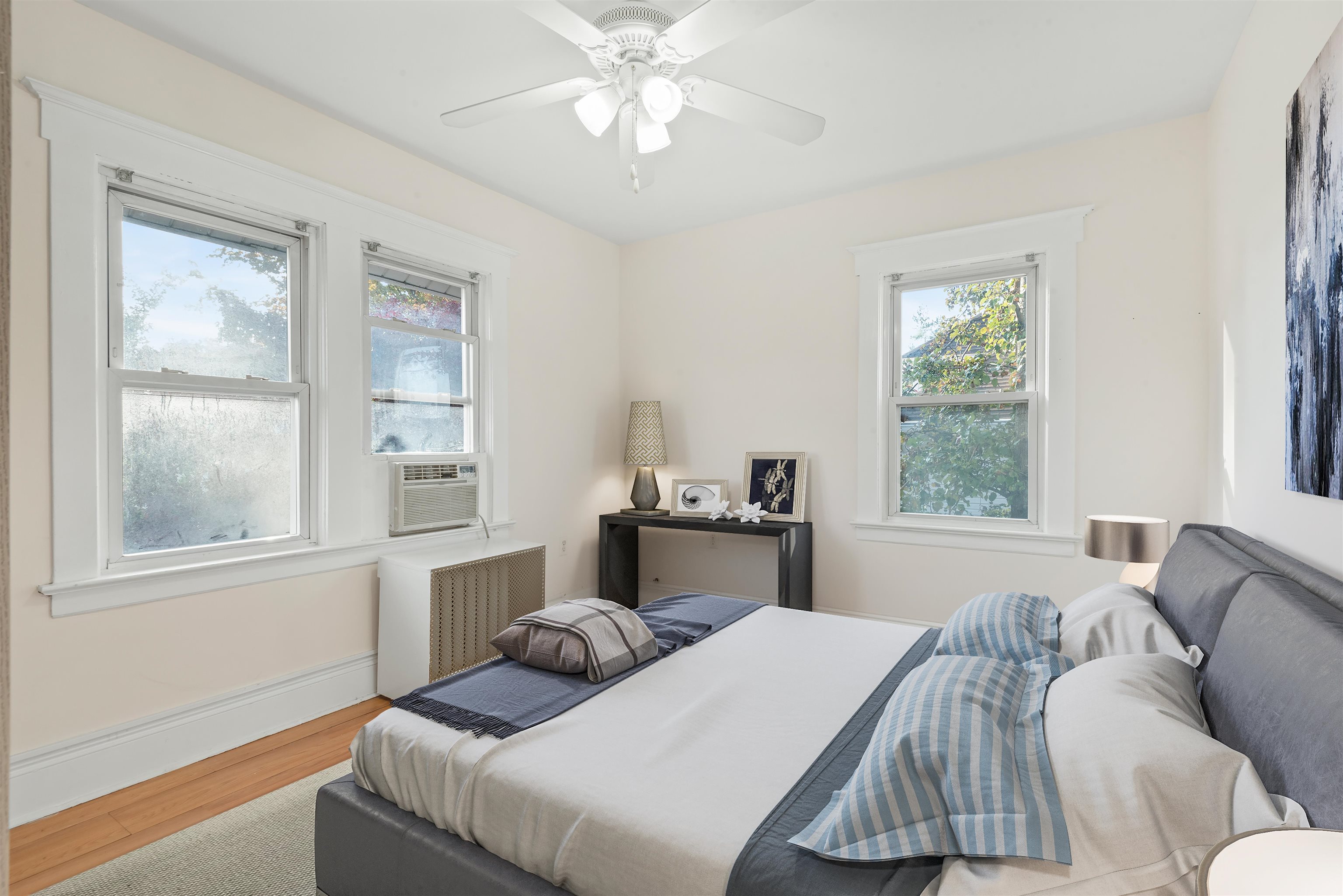 424 Lincoln Avenue Rutherford, NJ 07070 - Photo 13 of 30 a bedroom with a bed and a window with chair
