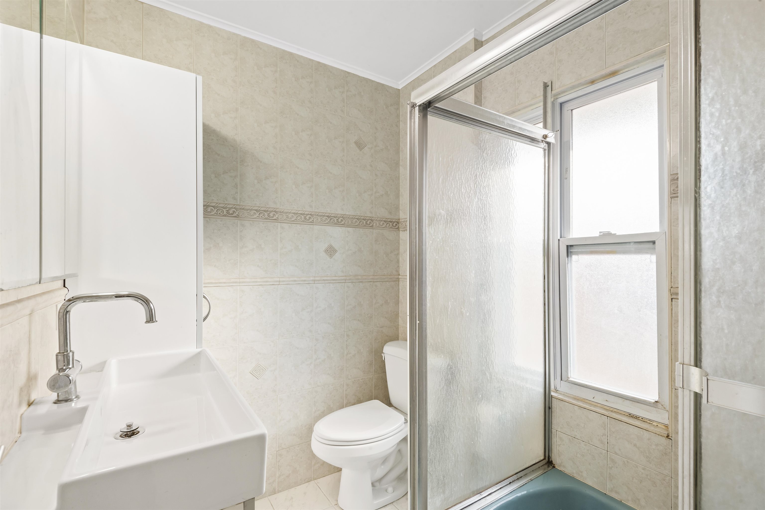 424 Lincoln Avenue Rutherford, NJ 07070 - Photo 14 of 30 a bathroom with a sink toilet and shower