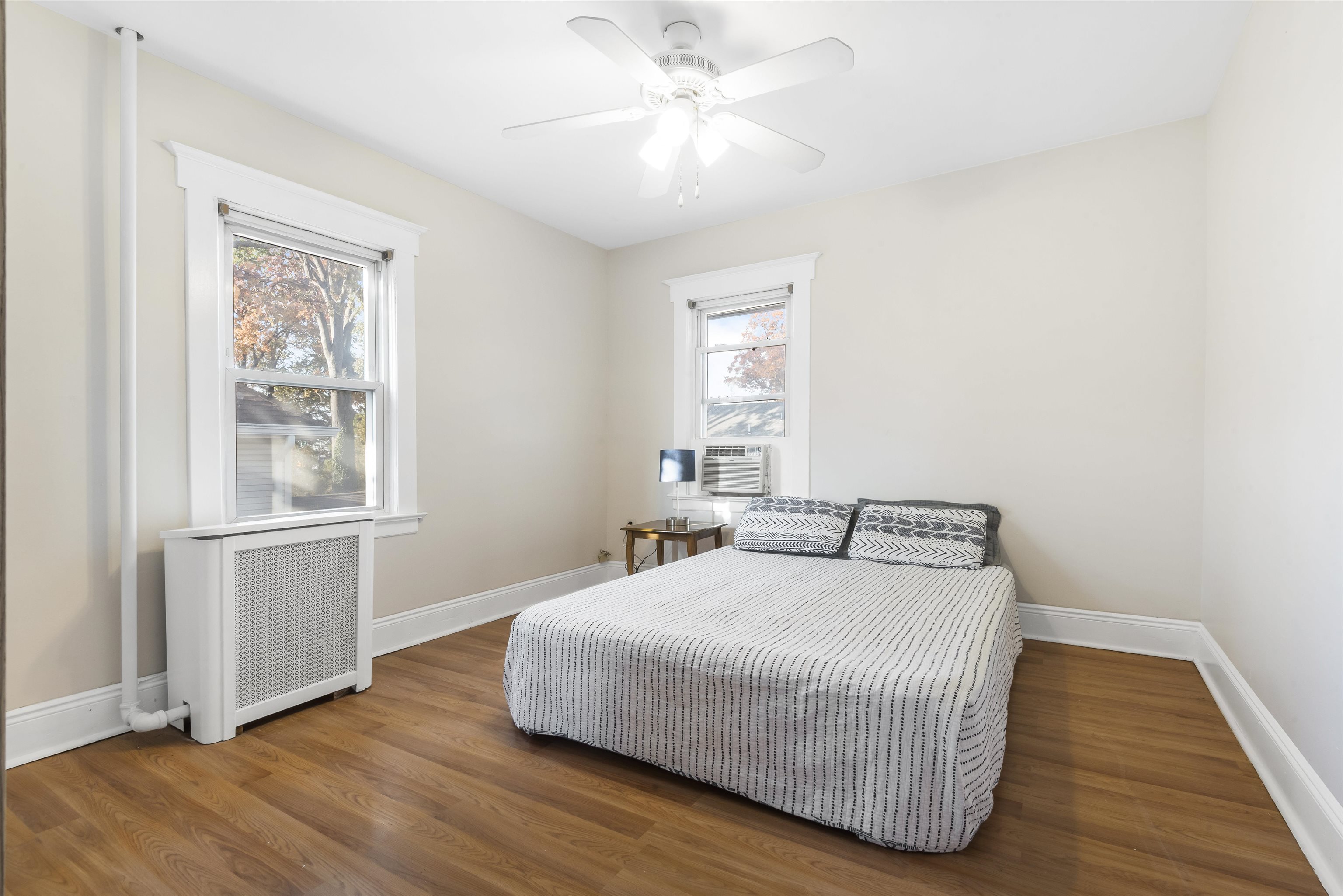 424 Lincoln Avenue Rutherford, NJ 07070 - Photo 15 of 30 a bedroom with a bed and wooden floor