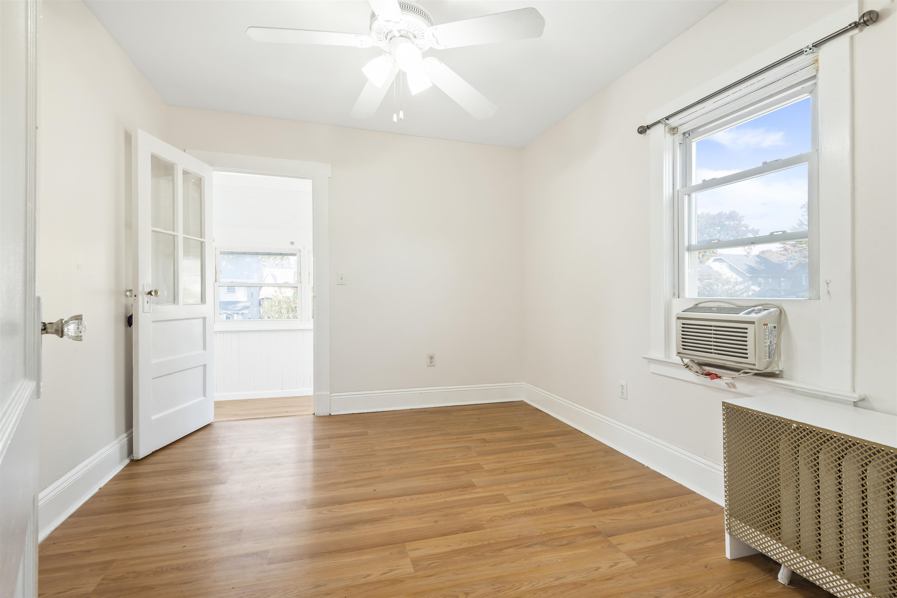 424 Lincoln Avenue Rutherford, NJ 07070 - Photo 16 of 30 an empty room with wooden floor and windows