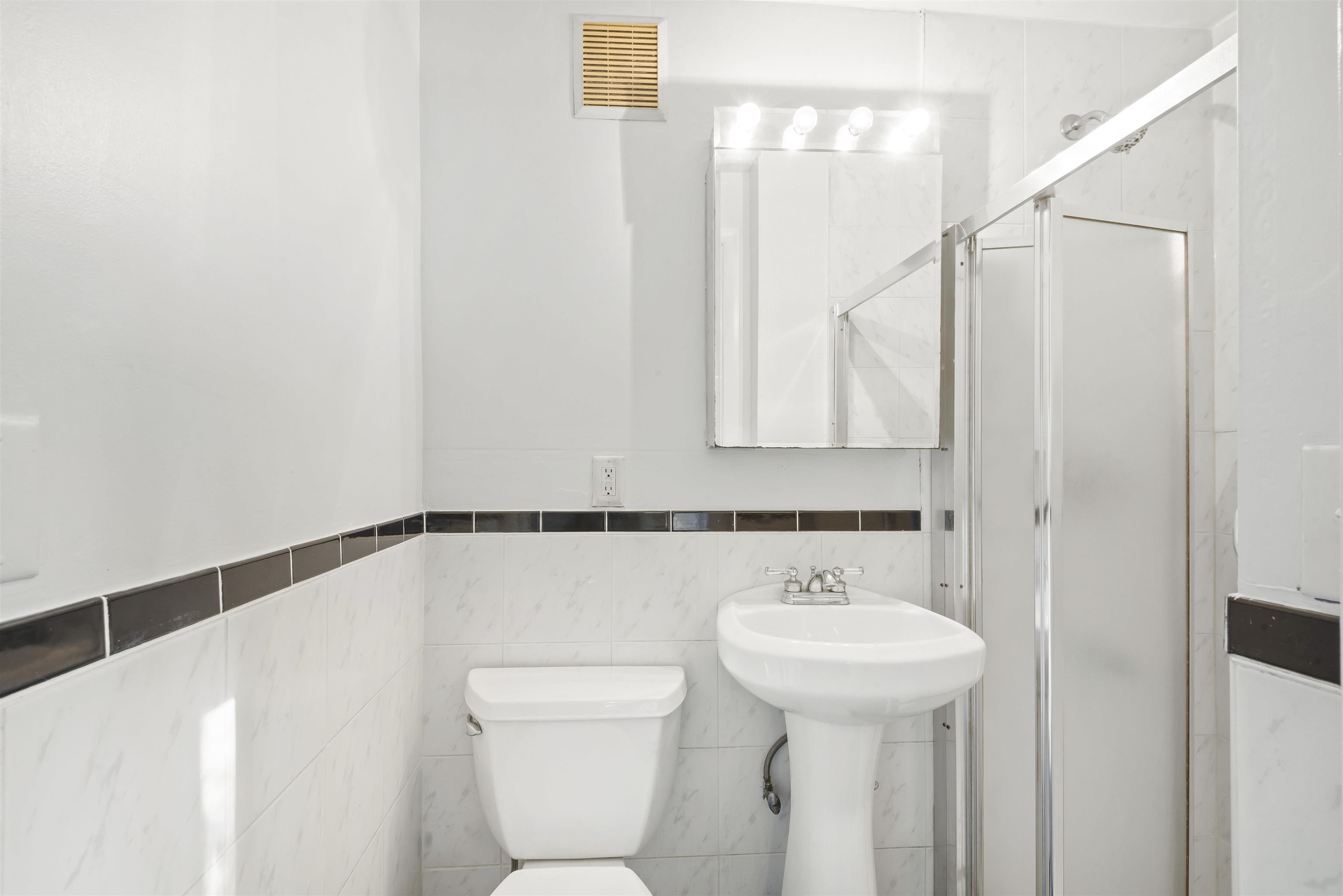 424 Lincoln Avenue Rutherford, NJ 07070 - Photo 20 of 30 a bathroom with a sink a toilet and shower