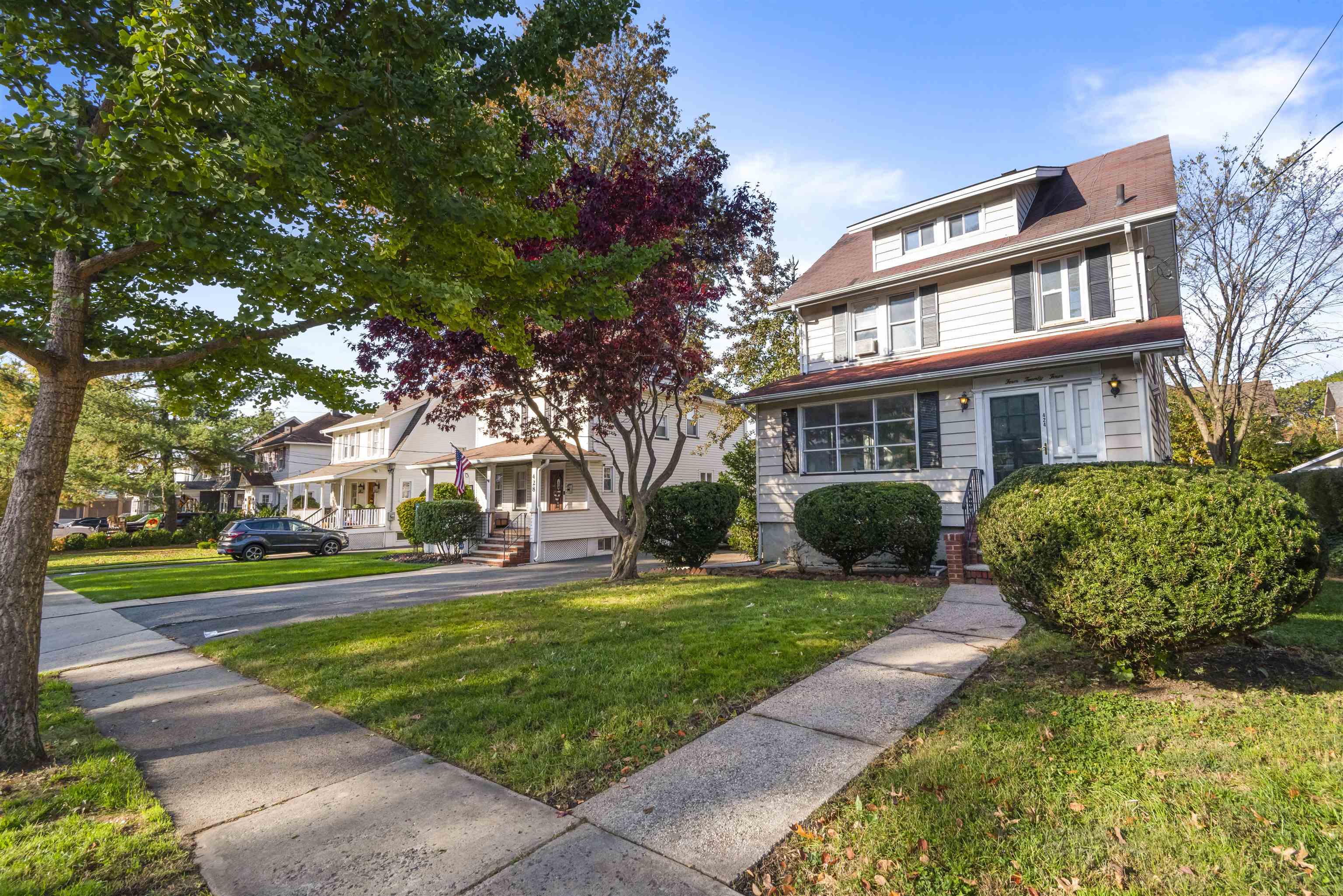 424 Lincoln Avenue Rutherford, NJ 07070 - Photo 3 of 30 a view of a building with a yard