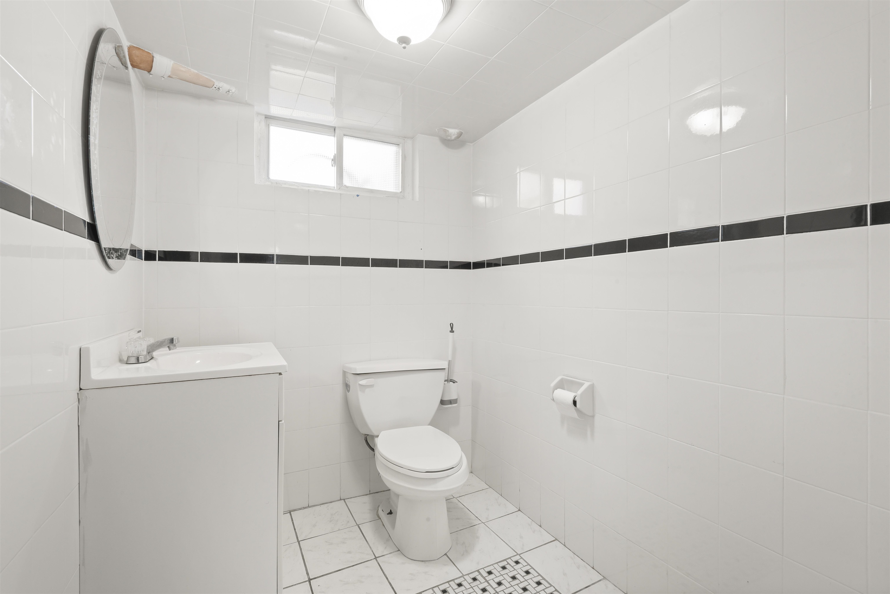 424 Lincoln Avenue Rutherford, NJ 07070 - Photo 24 of 30 a bathroom with a toilet a sink and a mirror