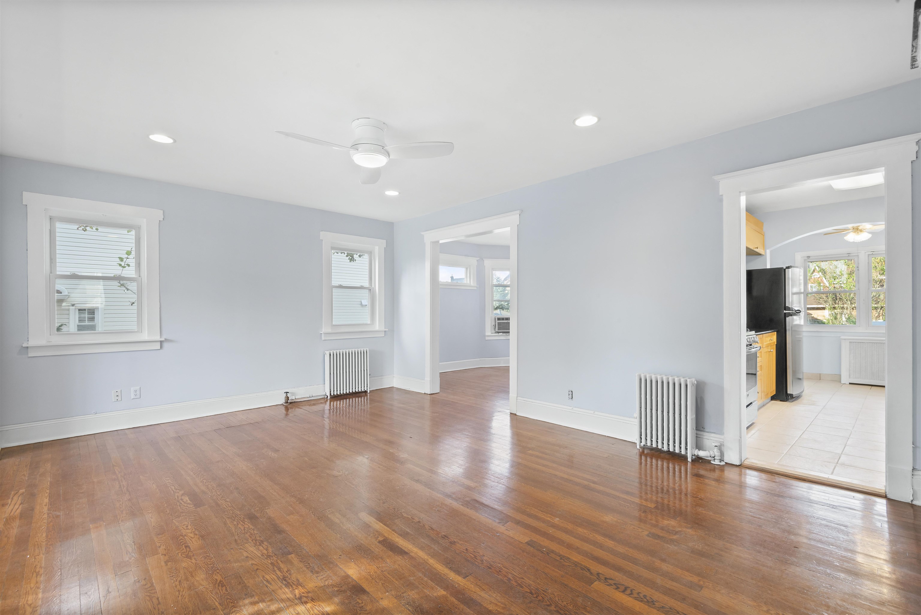 424 Lincoln Avenue Rutherford, NJ 07070 - Photo 4 of 30 a view of an empty room with wooden floor and a window