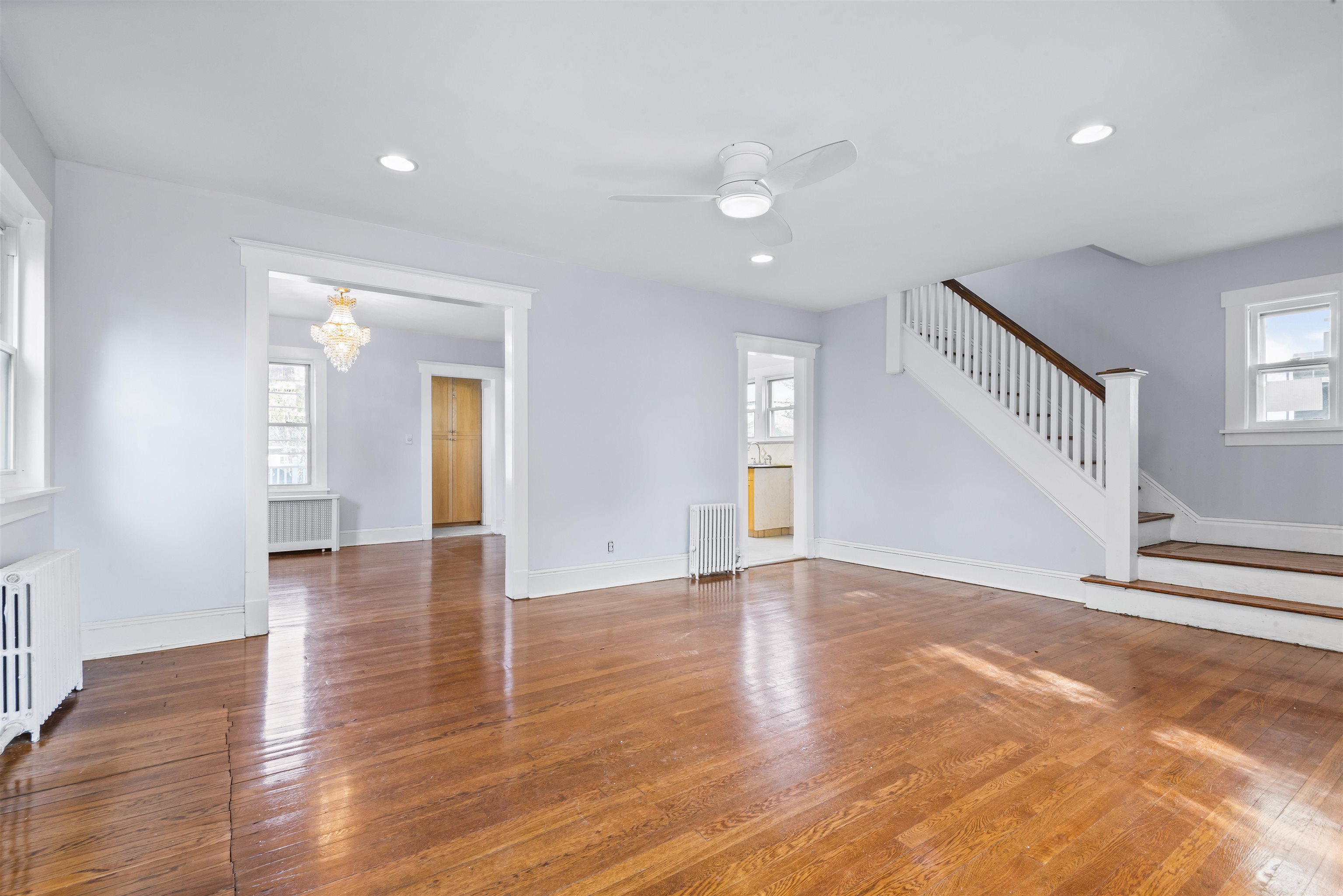 424 Lincoln Avenue Rutherford, NJ 07070 - Photo 7 of 30 a view of an empty room with wooden floor and a window