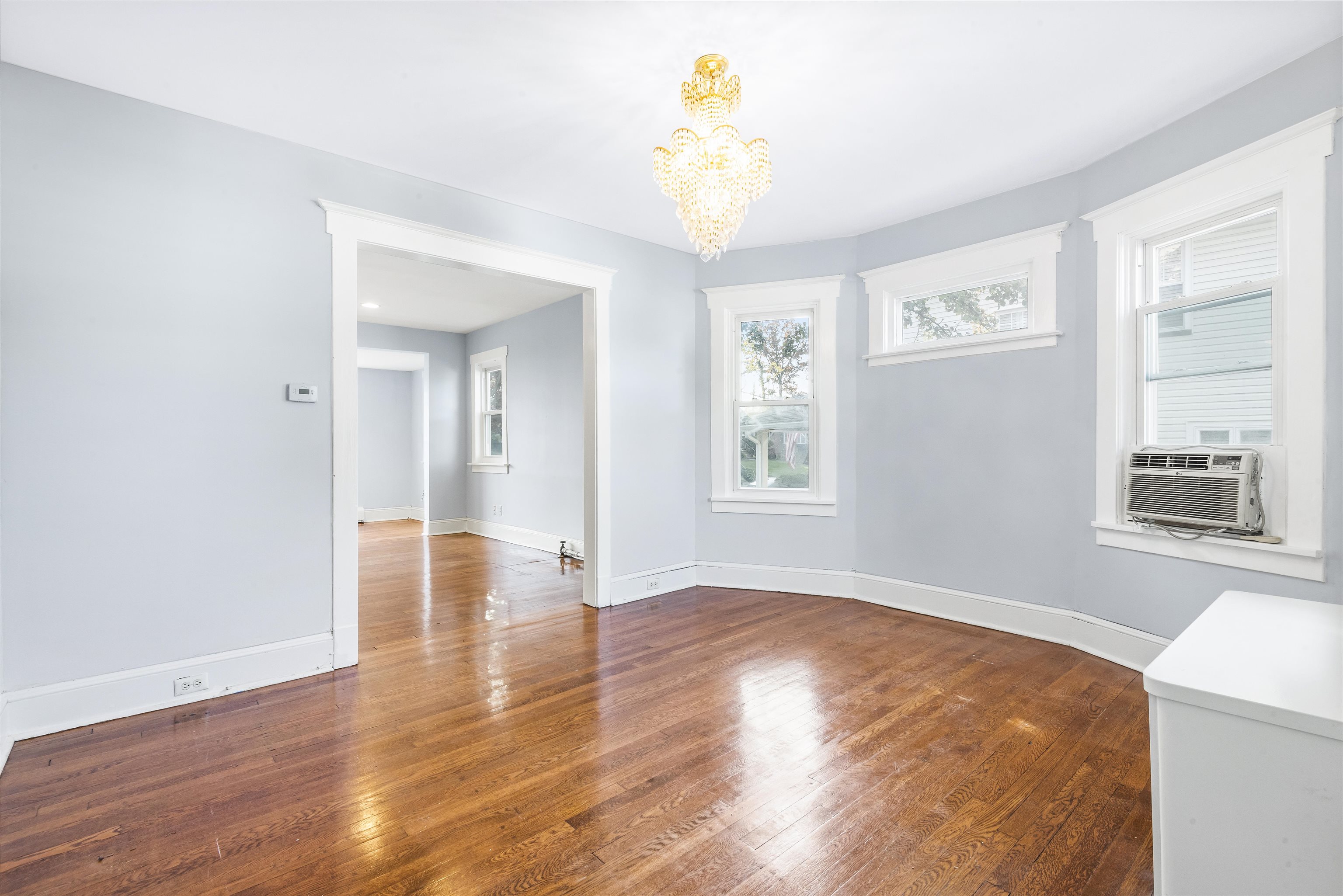 424 Lincoln Avenue Rutherford, NJ 07070 - Photo 8 of 30 an empty room with wooden floor and windows
