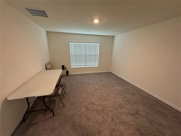 a workspace with furniture and window