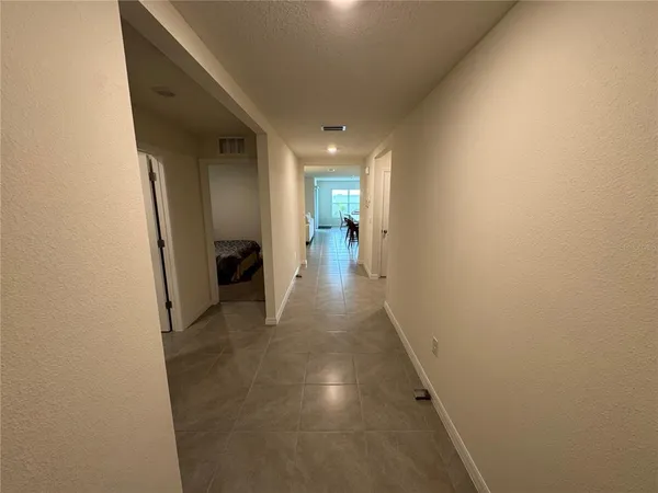 a view of a hallway view with staircase