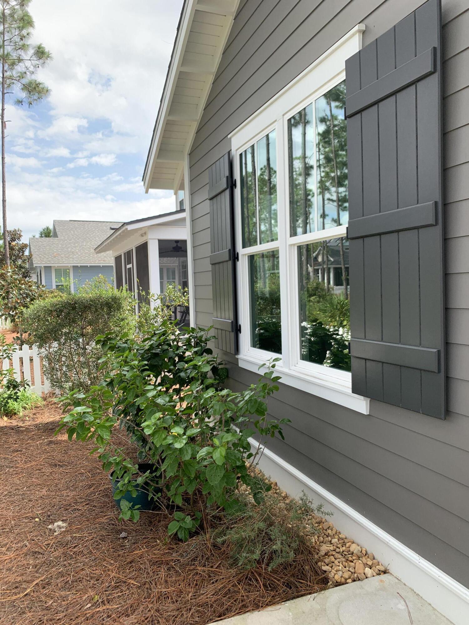 27 Somersault Lane Inlet Beach, FL 32461 - Photo 23 of 42 a house with lots of trees in front of it