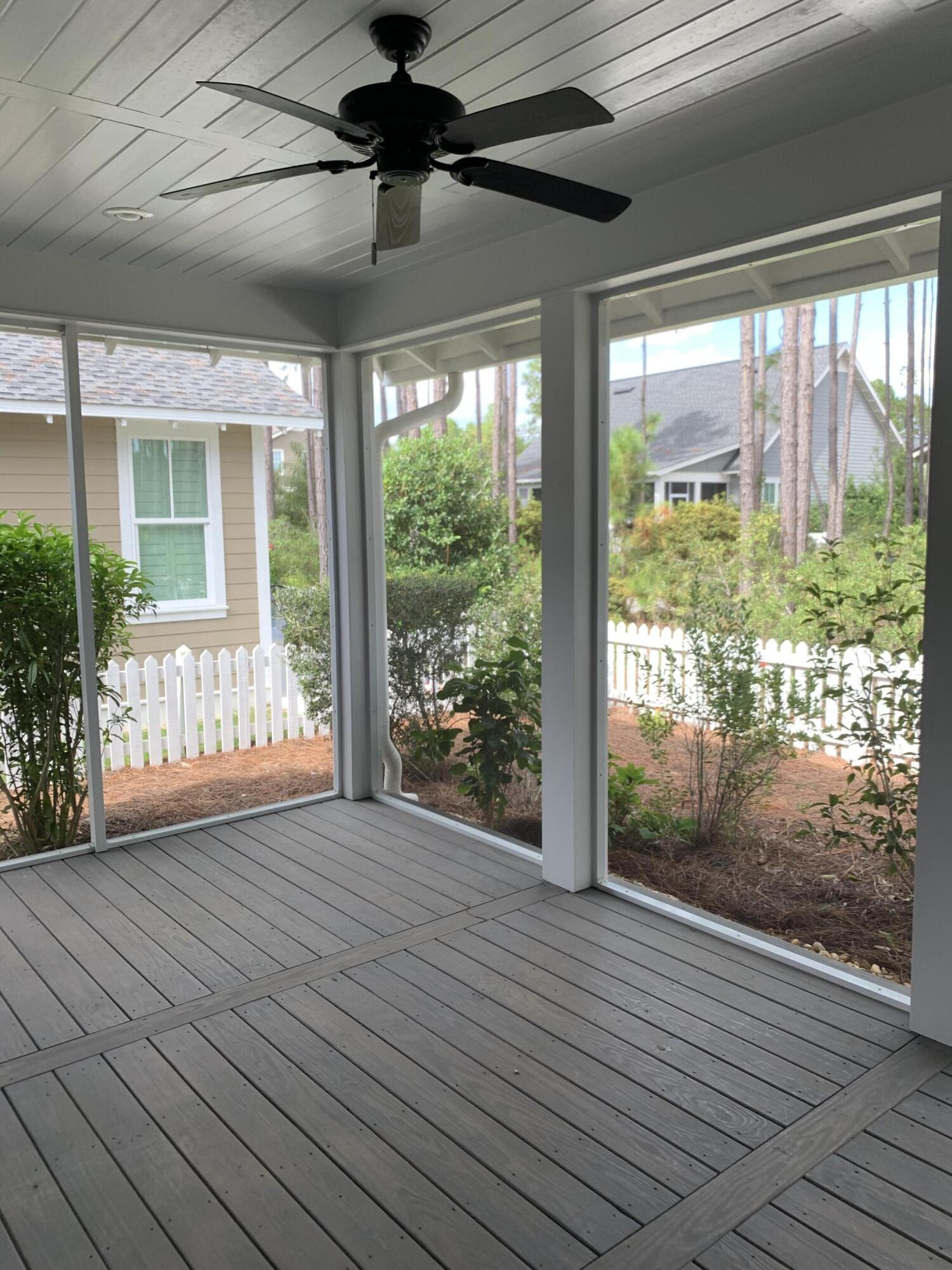 27 Somersault Lane Inlet Beach, FL 32461 - Photo 24 of 42 a view of an empty room with wooden floor and a floor to ceiling window