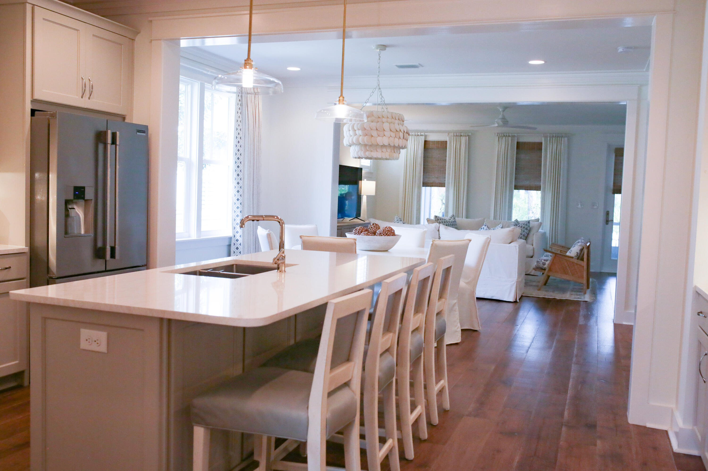 27 Somersault Lane Inlet Beach, FL 32461 - Photo 3 of 42 a dining room with stainless steel appliances granite countertop a dining table chairs and a refrigerator