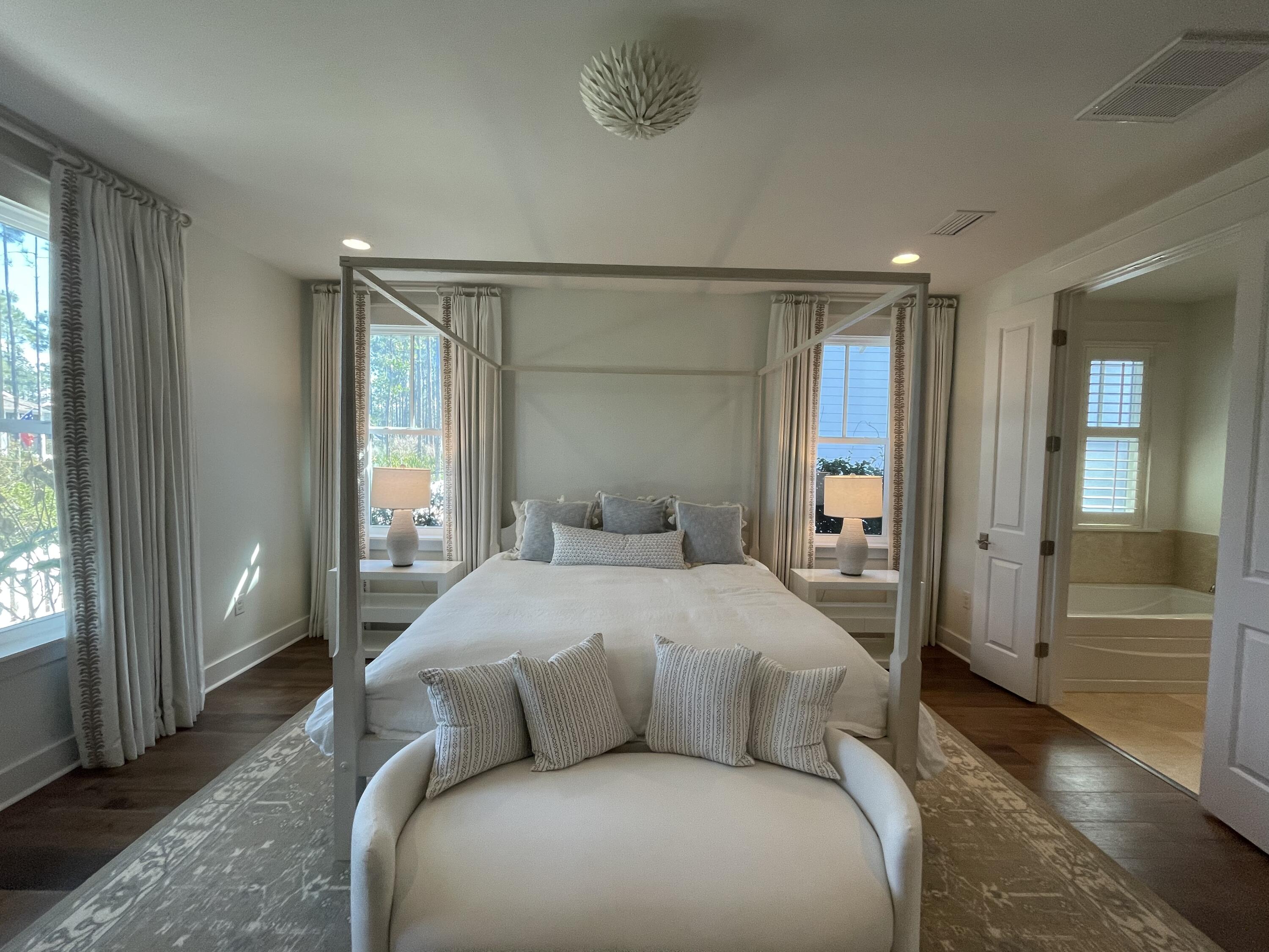 27 Somersault Lane Inlet Beach, FL 32461 - Photo 32 of 42 a bedroom with a large bed and a window