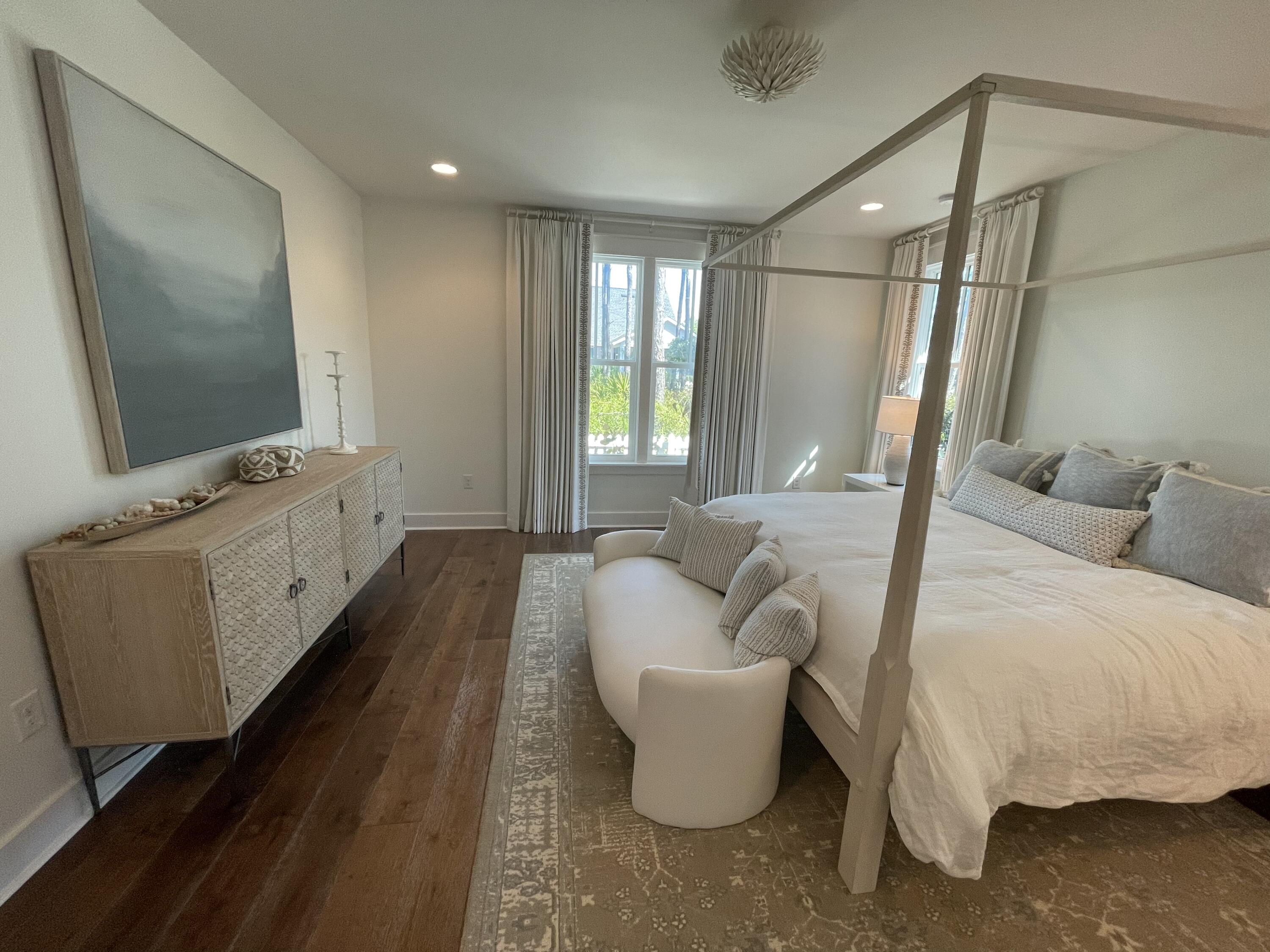 27 Somersault Lane Inlet Beach, FL 32461 - Photo 33 of 42 a spacious bedroom with a bed and a flat screen tv