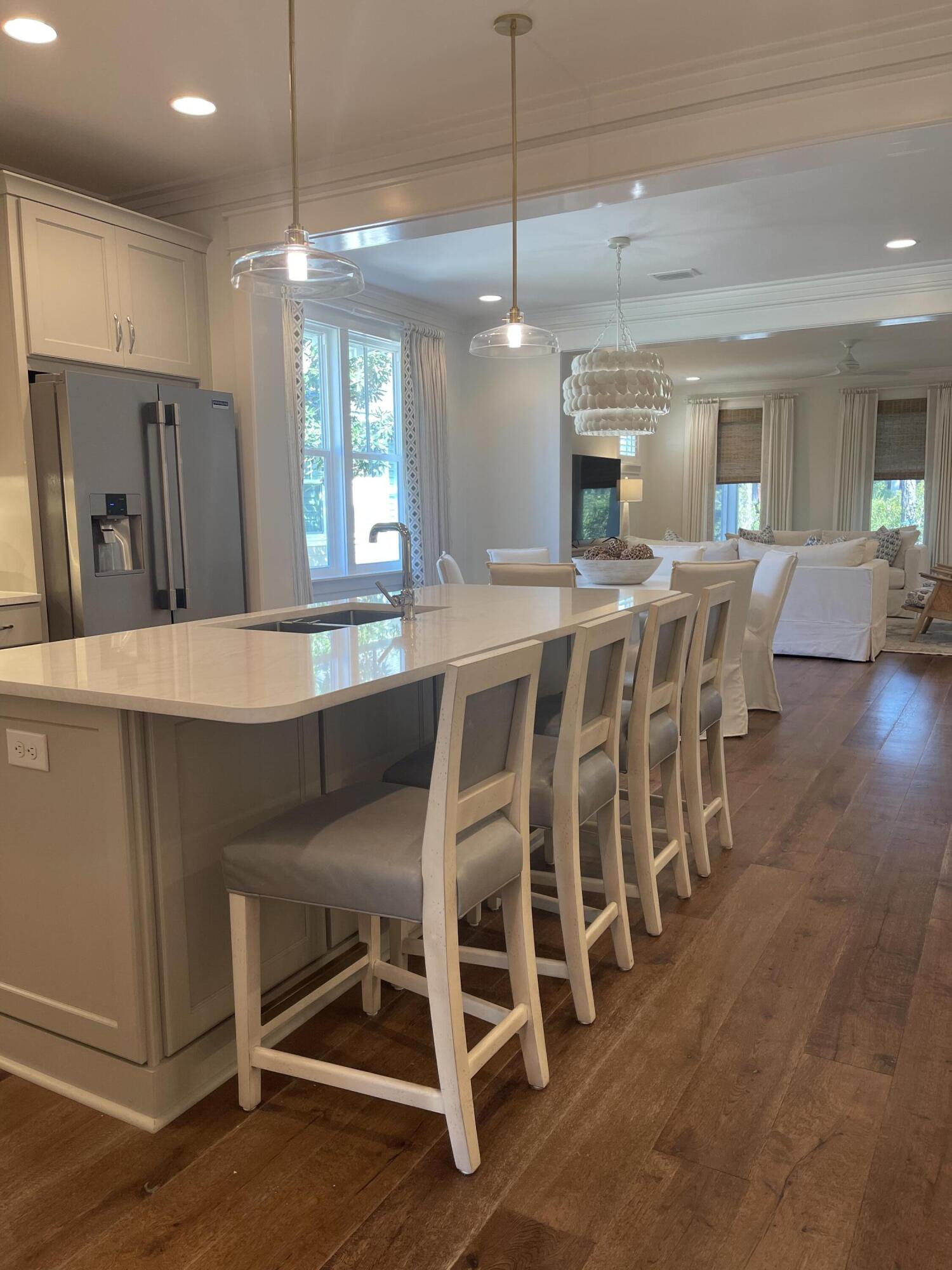 27 Somersault Lane Inlet Beach, FL 32461 - Photo 34 of 42 a large kitchen with a table and chairs