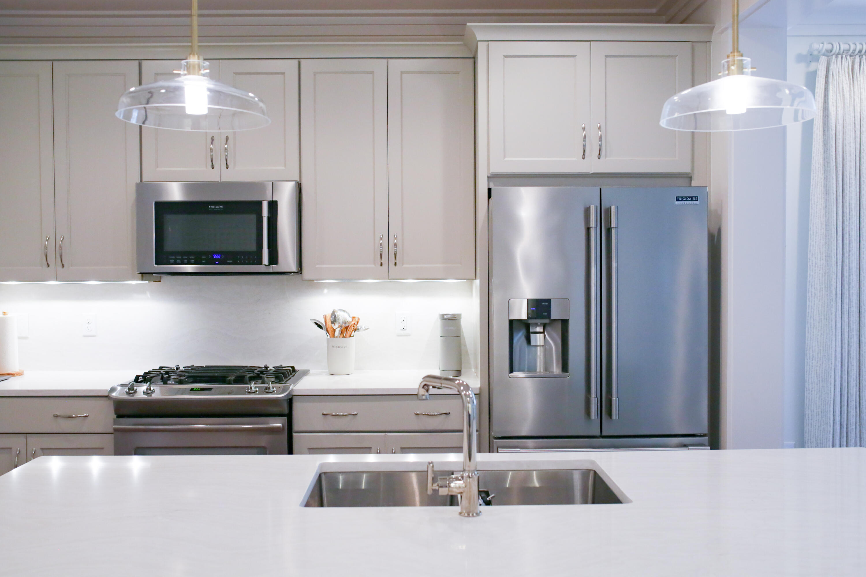 27 Somersault Lane Inlet Beach, FL 32461 - Photo 4 of 42 a kitchen with stainless steel appliances granite countertop a refrigerator a stove and a sink with granite countertops