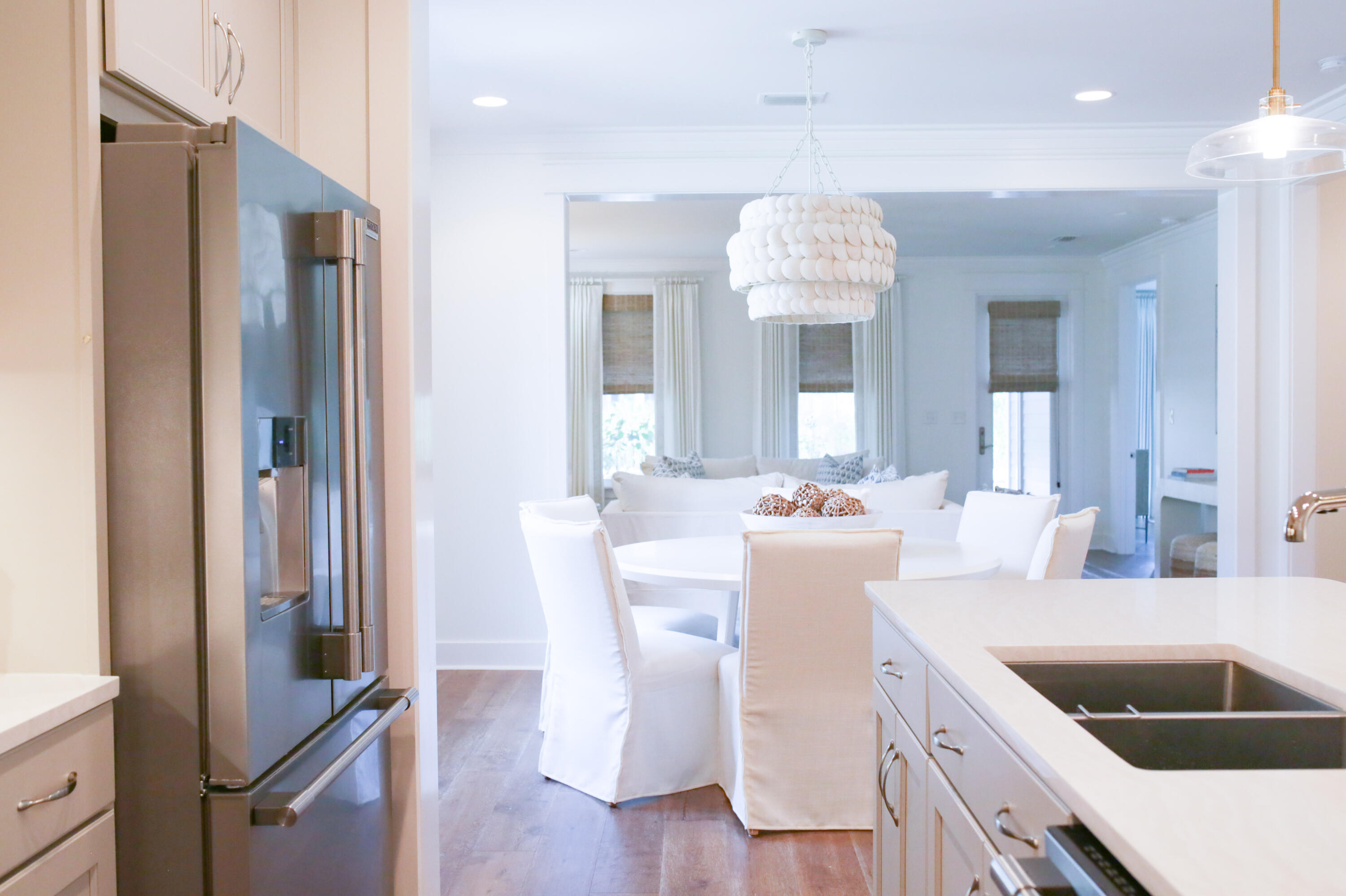 27 Somersault Lane Inlet Beach, FL 32461 - Photo 5 of 42 a kitchen with kitchen island granite countertop a refrigerator and a sink