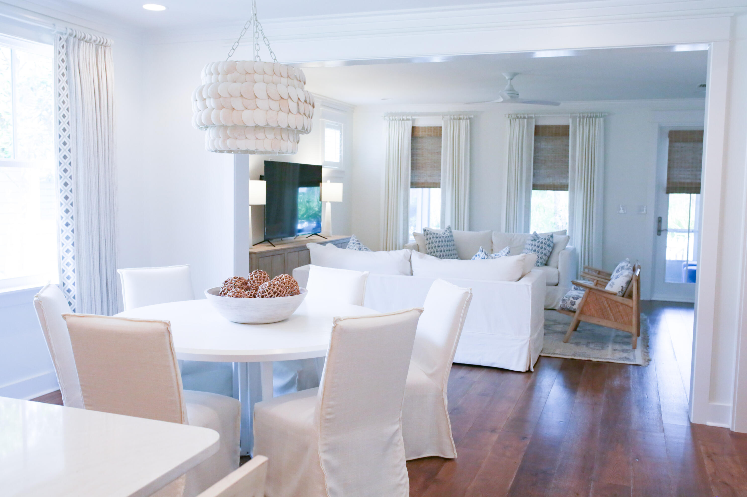 27 Somersault Lane Inlet Beach, FL 32461 - Photo 6 of 42 a view of a dining room with furniture wooden floor and chandelier