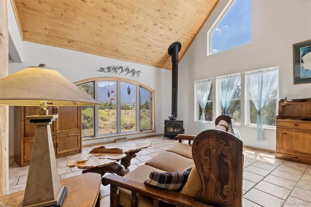 a view of a dining room with furniture and a chandelier