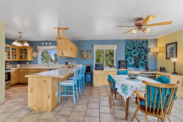 a kitchen with stainless steel appliances granite countertop a sink and cabinets