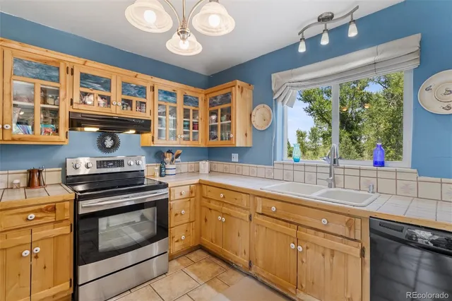 a bathroom with a granite countertop sink toilet and a mirror