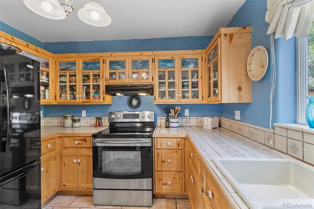a bedroom with a bed and a mirror on dresser