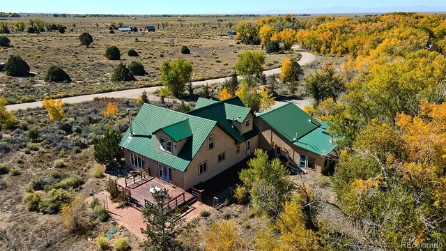 an aerial view of houses with yard