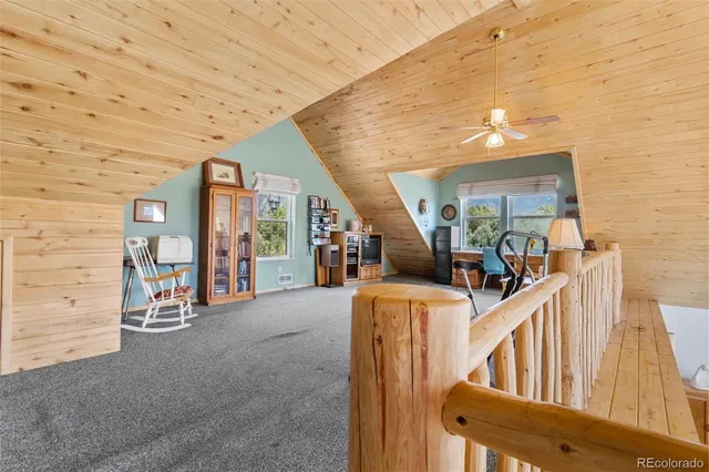 a view of hall way with furniture