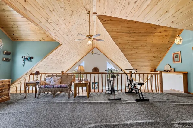 a bedroom with bed and a chandelier