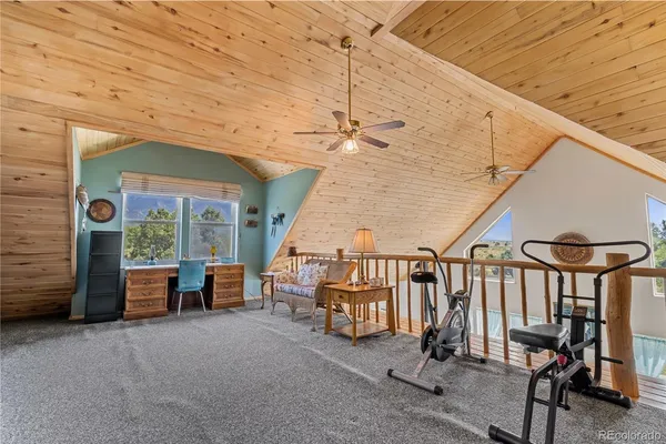 a bedroom with a bed and a television