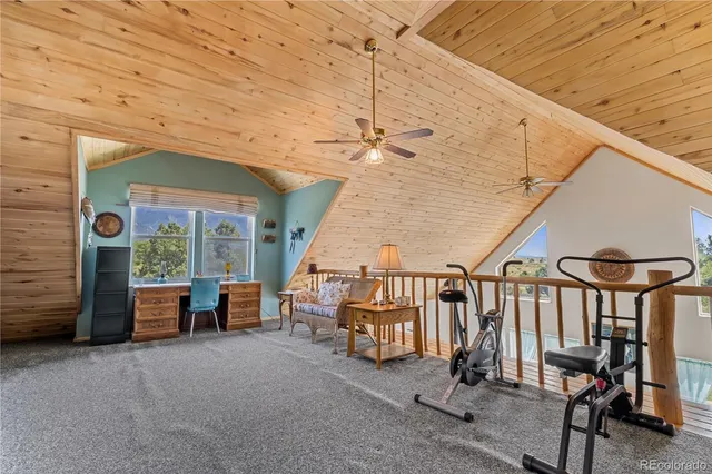 a bedroom with a bed and a television