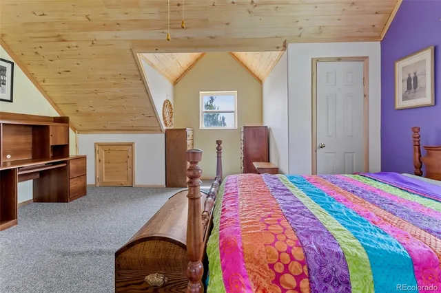 a room with cabinets and washer dryer