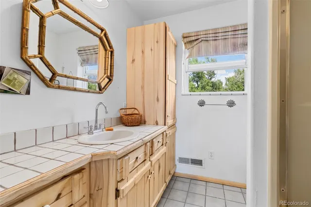 a living room with a couch and a shower