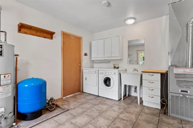 a living room with furniture and large windows