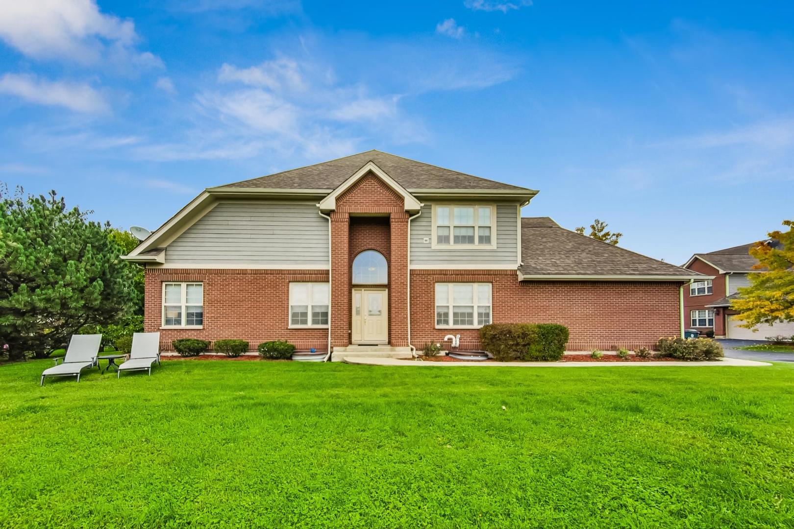 4427 Lainie Circle Glenview, IL 60026 - Photo 1 of 20 a front view of a house with a yard and trees