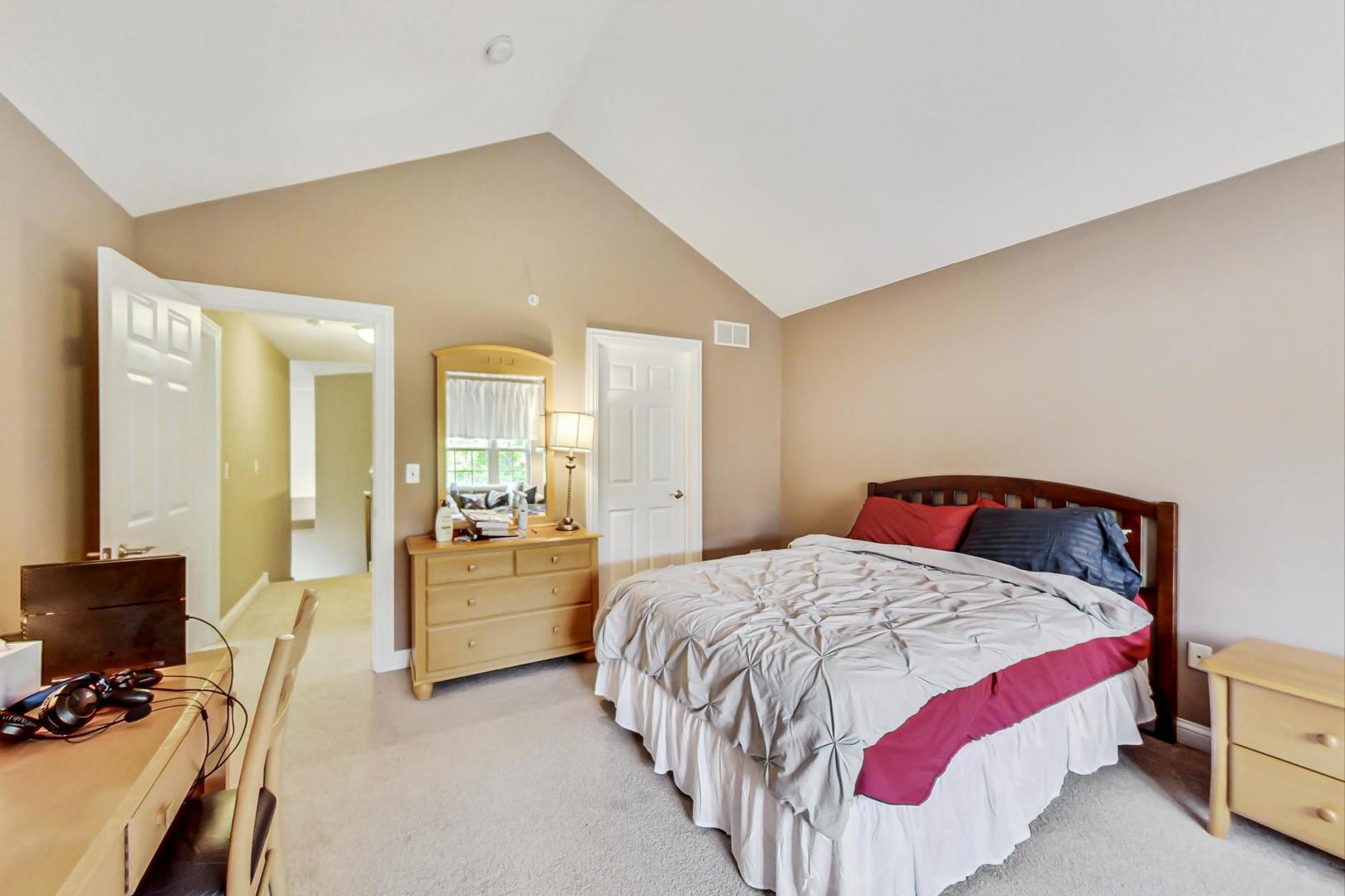 4427 Lainie Circle Glenview, IL 60026 - Photo 16 of 20 a bedroom with a bed and flat screen tv