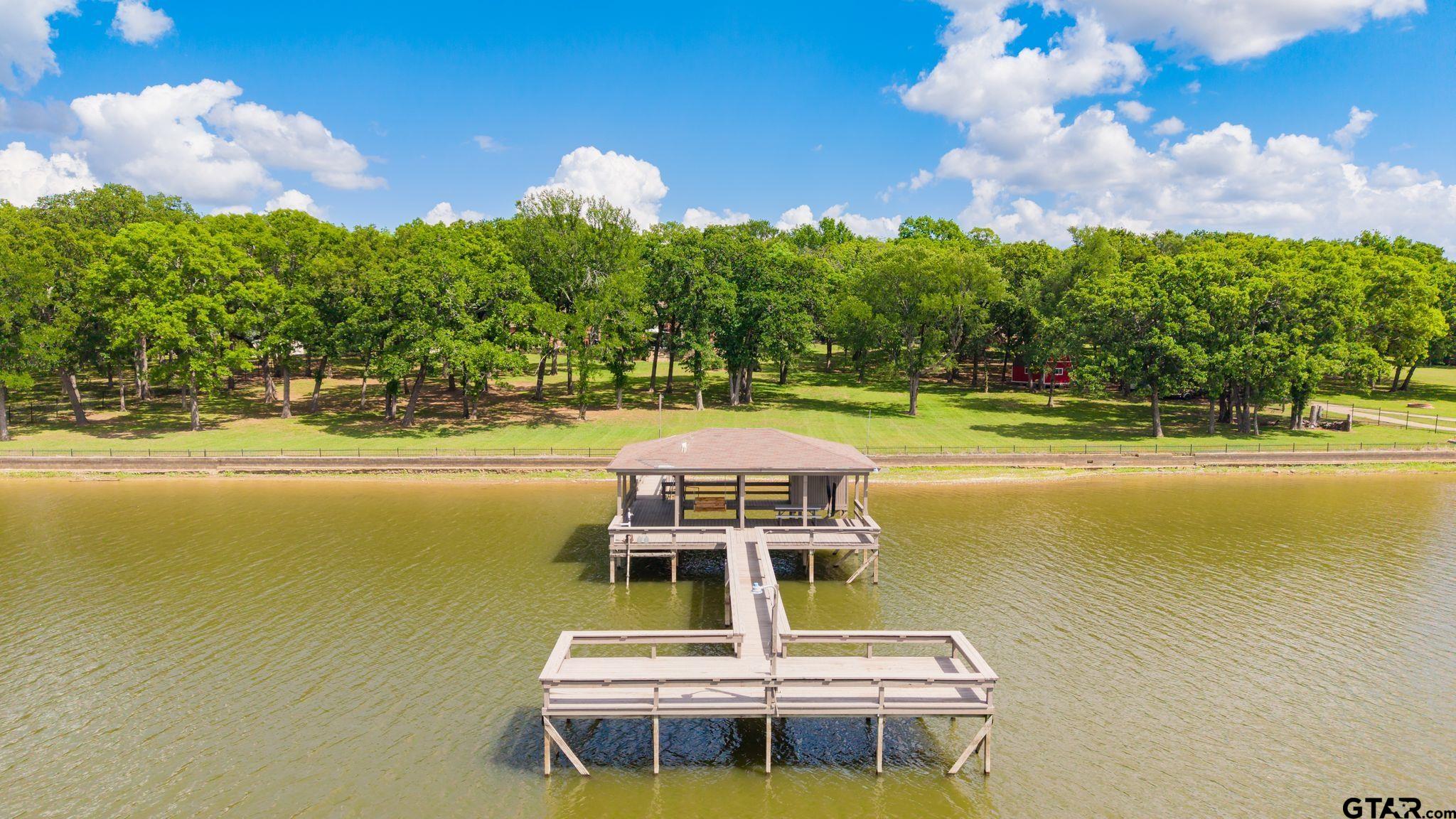 511 Rcr 3346 Emory, TX 75440 - Photo 2 of 48 a view of a lake with couches in front of it