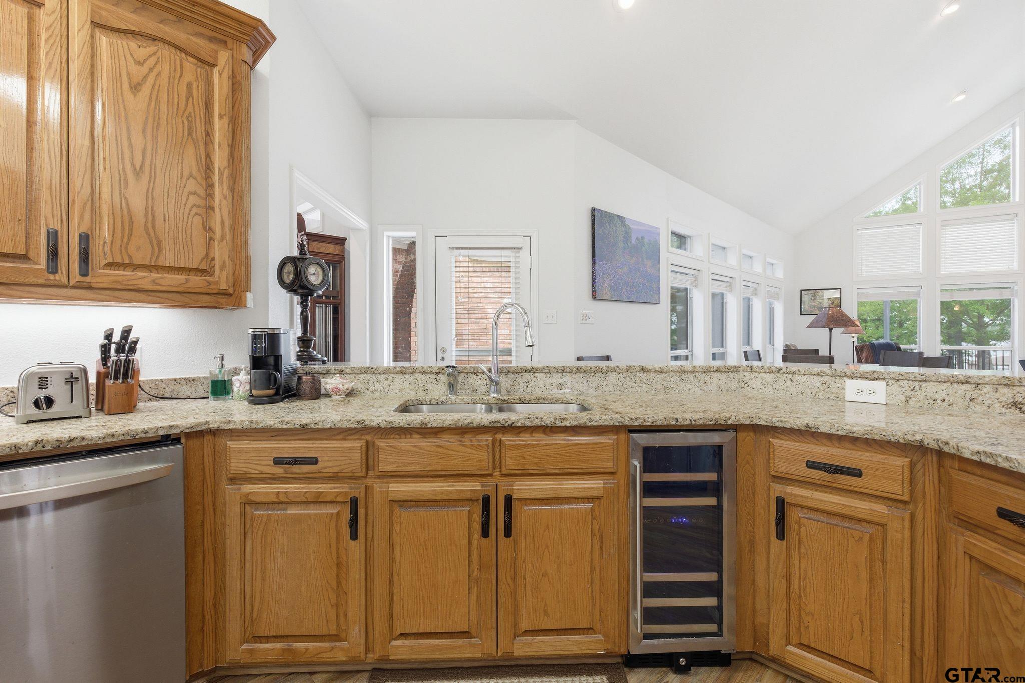 511 Rcr 3346 Emory, TX 75440 - Photo 26 of 48 a kitchen with granite countertop cabinets sink and window