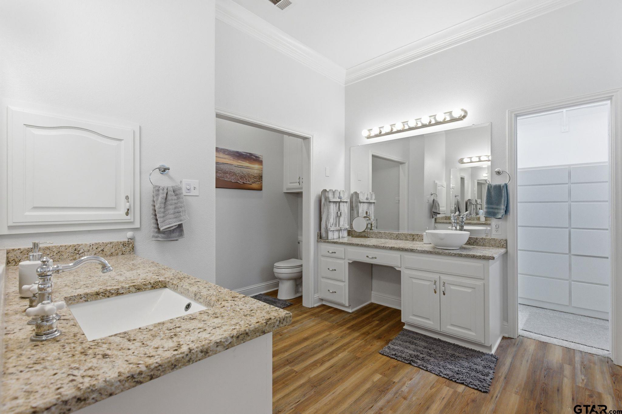 511 Rcr 3346 Emory, TX 75440 - Photo 39 of 48 a spacious bathroom with a granite countertop sink and a mirror