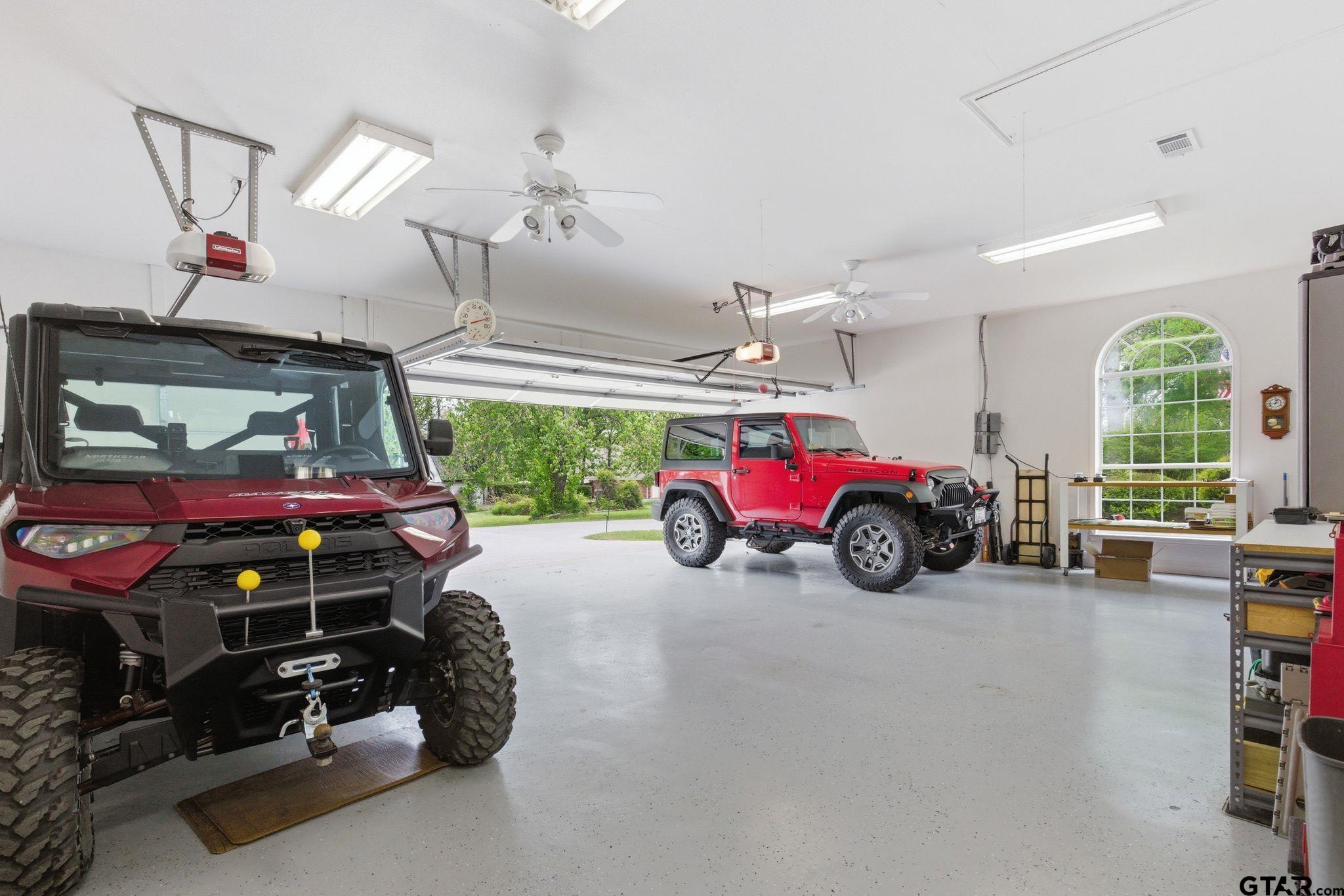 511 Rcr 3346 Emory, TX 75440 - Photo 48 of 48 a view of a garage with a tv and a large window